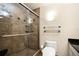 Contemporary bathroom with a glass-enclosed tiled shower and modern fixtures at 1055 Kensington Park Dr # 203, Altamonte Springs, FL 32714