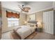 Cozy bedroom with neutral tones, a ceiling fan, and ample natural light at 1055 Kensington Park Dr # 203, Altamonte Springs, FL 32714