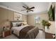 Inviting bedroom with a plush bed, decorative accents, and a large window at 1055 Kensington Park Dr # 203, Altamonte Springs, FL 32714