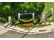 Landscaped entrance sign for Kensington Park with manicured bushes and flower beds at 1055 Kensington Park Dr # 203, Altamonte Springs, FL 32714