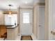 View of the home's entryway featuring a tiled floor, decorative glass front door, and pendant lighting at 1055 Kensington Park Dr # 203, Altamonte Springs, FL 32714