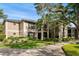 Charming condo building with manicured landscaping, lush green grass and mature trees at 1055 Kensington Park Dr # 203, Altamonte Springs, FL 32714