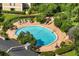 Overhead shot of a private, well-maintained community pool with lounge chairs at 1055 Kensington Park Dr # 203, Altamonte Springs, FL 32714