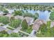 Aerial view of the homes in the neighborhood, surrounded by mature trees and a large lake at 1067 Chatham Break St, Orlando, FL 32828