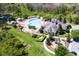 Comprehensive aerial perspective featuring community pool, playground, clubhouse, and beautifully landscaped grounds at 1067 Chatham Break St, Orlando, FL 32828