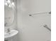 Pedestal sink with chrome fixtures, a mirror, and grab bar in the well-lit bathroom at 1067 Chatham Break St, Orlando, FL 32828
