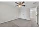 A bedroom featuring neutral walls, ceiling fan, and a closet with a full-length double doors at 1067 Chatham Break St, Orlando, FL 32828