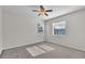 Bedroom featuring a ceiling fan and large windows for natural lighting at 1067 Chatham Break St, Orlando, FL 32828