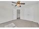 Bright bedroom has a carpeted floor, ceiling fan, double door closet, and bright windows at 1067 Chatham Break St, Orlando, FL 32828