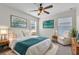 Well decorated bedroom with large bed, side tables and chair at 1067 Chatham Break St, Orlando, FL 32828