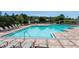Inviting community pool with ample seating, sun loungers, and well-maintained brick-paved deck at 1067 Chatham Break St, Orlando, FL 32828