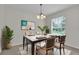 Bright dining room with modern light fixture, large window, and decorative accents at 1067 Chatham Break St, Orlando, FL 32828