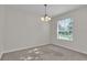An empty room that features a carpeted floor, one window and modern lighting fixture at 1067 Chatham Break St, Orlando, FL 32828