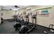 Well-equipped fitness center with modern treadmills, elliptical machines, and mounted televisions at 1067 Chatham Break St, Orlando, FL 32828