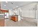 Well-lit kitchen with stainless steel appliances, wood cabinets, and open access to living spaces at 1067 Chatham Break St, Orlando, FL 32828