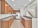 Modern kitchen featuring stainless steel appliances, ample counter space, and wooden cabinets at 1067 Chatham Break St, Orlando, FL 32828