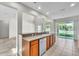 Bright kitchen with stainless steel dishwasher and sink overlooking backyard through sliding glass door at 1067 Chatham Break St, Orlando, FL 32828