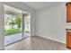 Covered patio overlooking fenced-in yard, accessible through sliding glass door at 1067 Chatham Break St, Orlando, FL 32828