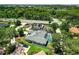 Aerial view of the home with a screened-in pool, surrounded by lush greenery and mature trees at 111 Woodstream Ct Ct, Maitland, FL 32751