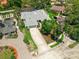 Aerial view showcasing a home with a long driveway, well-manicured lawn, and lush landscaping at 111 Woodstream Ct Ct, Maitland, FL 32751