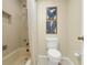 Bathroom featuring a shower and toilet with beige walls at 111 Woodstream Ct Ct, Maitland, FL 32751