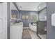 Modern bathroom features double sinks, an illuminated mirror, and a jacuzzi tub and shower combo at 111 Woodstream Ct Ct, Maitland, FL 32751