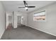 Bedroom with a ceiling fan, plush carpeting, natural light, and mirrored closet doors adding depth to the space at 111 Woodstream Ct Ct, Maitland, FL 32751