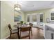 Cozy breakfast nook featuring a glass table, backyard views, and access to other rooms at 111 Woodstream Ct Ct, Maitland, FL 32751