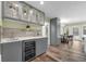 Modern kitchen with custom cabinets, wine cooler, and an adjacent breakfast nook at 111 Woodstream Ct Ct, Maitland, FL 32751