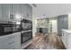 Spacious kitchen features stainless appliances, a breakfast nook, and access to other rooms at 111 Woodstream Ct Ct, Maitland, FL 32751