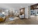 Bright living room featuring a brick fireplace and open dining area with modern decor at 111 Woodstream Ct Ct, Maitland, FL 32751
