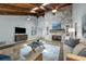 Cozy living room with stone fireplace, wood floors, and vaulted ceilings at 111 Woodstream Ct Ct, Maitland, FL 32751