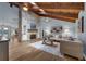 Inviting living room features wood floors, a stone fireplace and built-in bookshelves at 111 Woodstream Ct Ct, Maitland, FL 32751