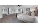 Large main bedroom features lots of light, a seating area, light walls and a ceiling fan at 111 Woodstream Ct Ct, Maitland, FL 32751