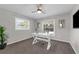Inviting office space with natural light, features modern white desk and ceiling fan at 111 Woodstream Ct Ct, Maitland, FL 32751