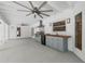 Covered outdoor kitchen with stainless steel grill and mini-fridge at 111 Woodstream Ct Ct, Maitland, FL 32751