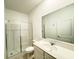 Clean bathroom featuring a glass shower, vanity with a sink, and modern fixtures at 1147 Pomelo St, Davenport, FL 33837