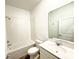 Bright bathroom featuring a shower-tub combo, vanity with sink, and modern fixtures at 1147 Pomelo St, Davenport, FL 33837
