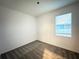 Cozy bedroom featuring neutral carpet and natural light from the window at 1147 Pomelo St, Davenport, FL 33837