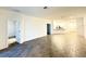 Spacious living area featuring modern flooring and an open layout with lots of natural light at 1147 Pomelo St, Davenport, FL 33837