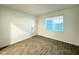Entry room features wood-style ceramic tile and natural light from the window at 1147 Pomelo St, Davenport, FL 33837