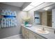 Bathroom featuring a vanity with a large mirror and a decorative shower curtain at 116 E Plantation Blvd, Lake Mary, FL 32746