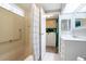 Bathroom includes vanity, tub, shower curtain, and washer/dryer at 116 E Plantation Blvd, Lake Mary, FL 32746