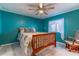 Bedroom featuring a ceiling fan, natural light and chair at 116 E Plantation Blvd, Lake Mary, FL 32746