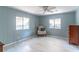 Bedroom has two windows, neutral walls and flooring, as well as a dark wood dresser at 116 E Plantation Blvd, Lake Mary, FL 32746