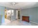 Bedroom boasts light walls and flooring with a view of an attached bathroom at 116 E Plantation Blvd, Lake Mary, FL 32746
