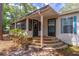 Inviting entrance with stone steps, a screened porch, and dual entry doors at 116 E Plantation Blvd, Lake Mary, FL 32746