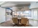 Spacious eat-in kitchen with a large island cooktop and white cabinets with stainless steel appliances at 116 E Plantation Blvd, Lake Mary, FL 32746