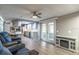 Spacious living room with modern flooring provides access to the kitchen and lanai at 116 E Plantation Blvd, Lake Mary, FL 32746