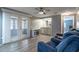 Cozy living room with a wet bar, electric fireplace and sliding glass doors leading to a lanai at 116 E Plantation Blvd, Lake Mary, FL 32746